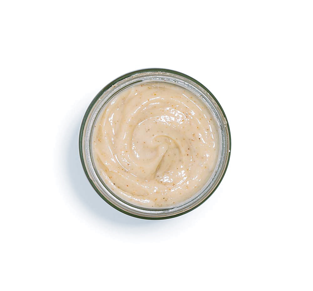 Top view of an opened jar of Finely Awake Plantfoliant.